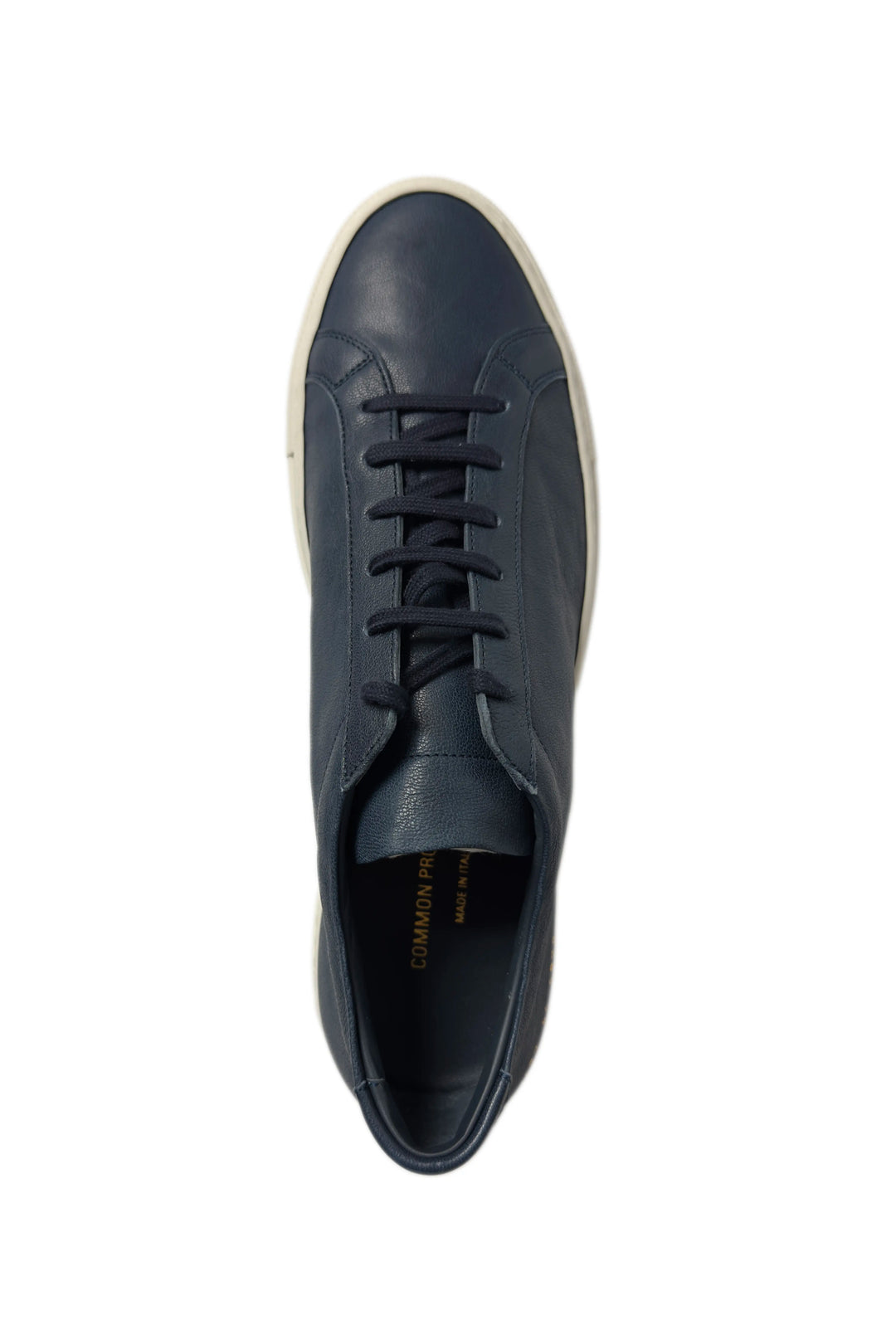 Navy blue leather sneaker on a white background