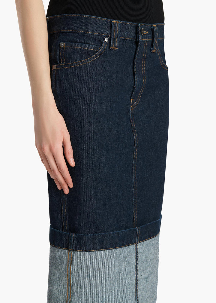 Dark blue denim skirt with a white background