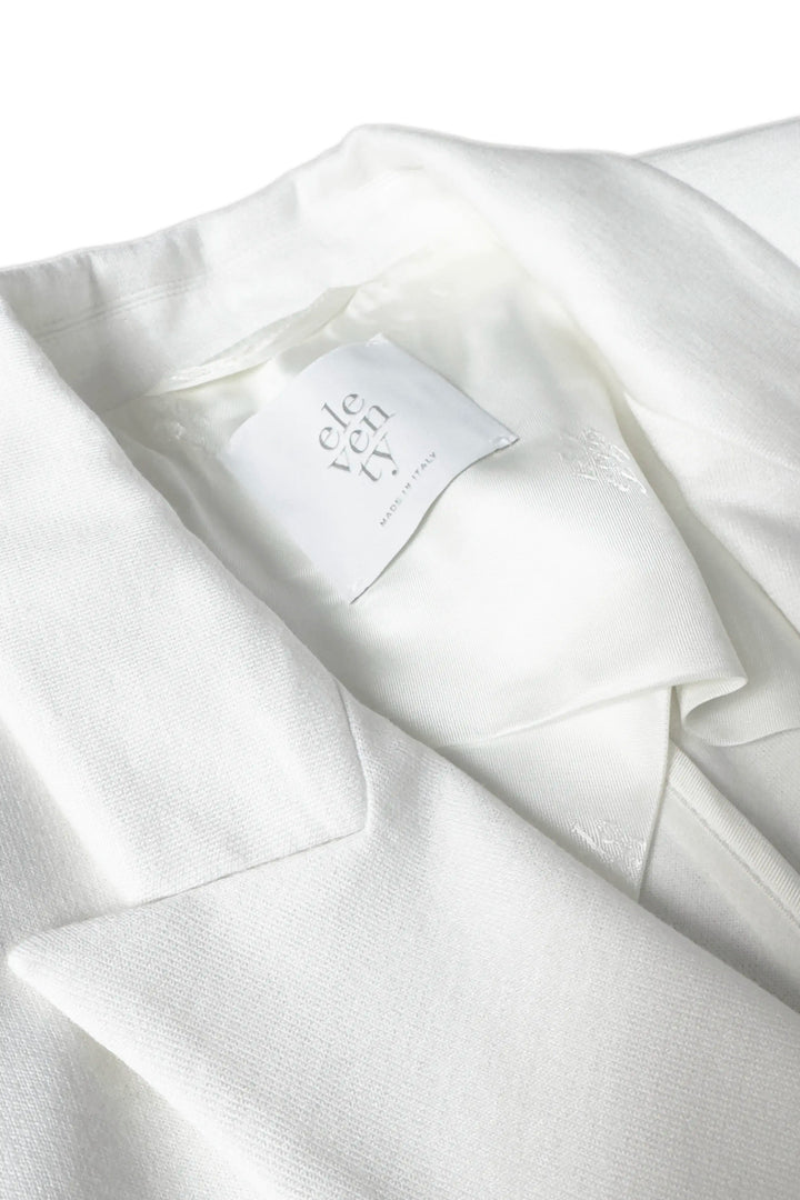 White fabric with a brand label on a white background