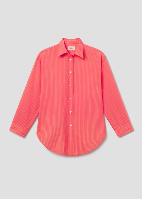Coral striped shirt on a light gray background