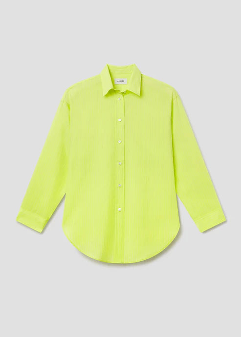 Neon green shirt on a light gray background