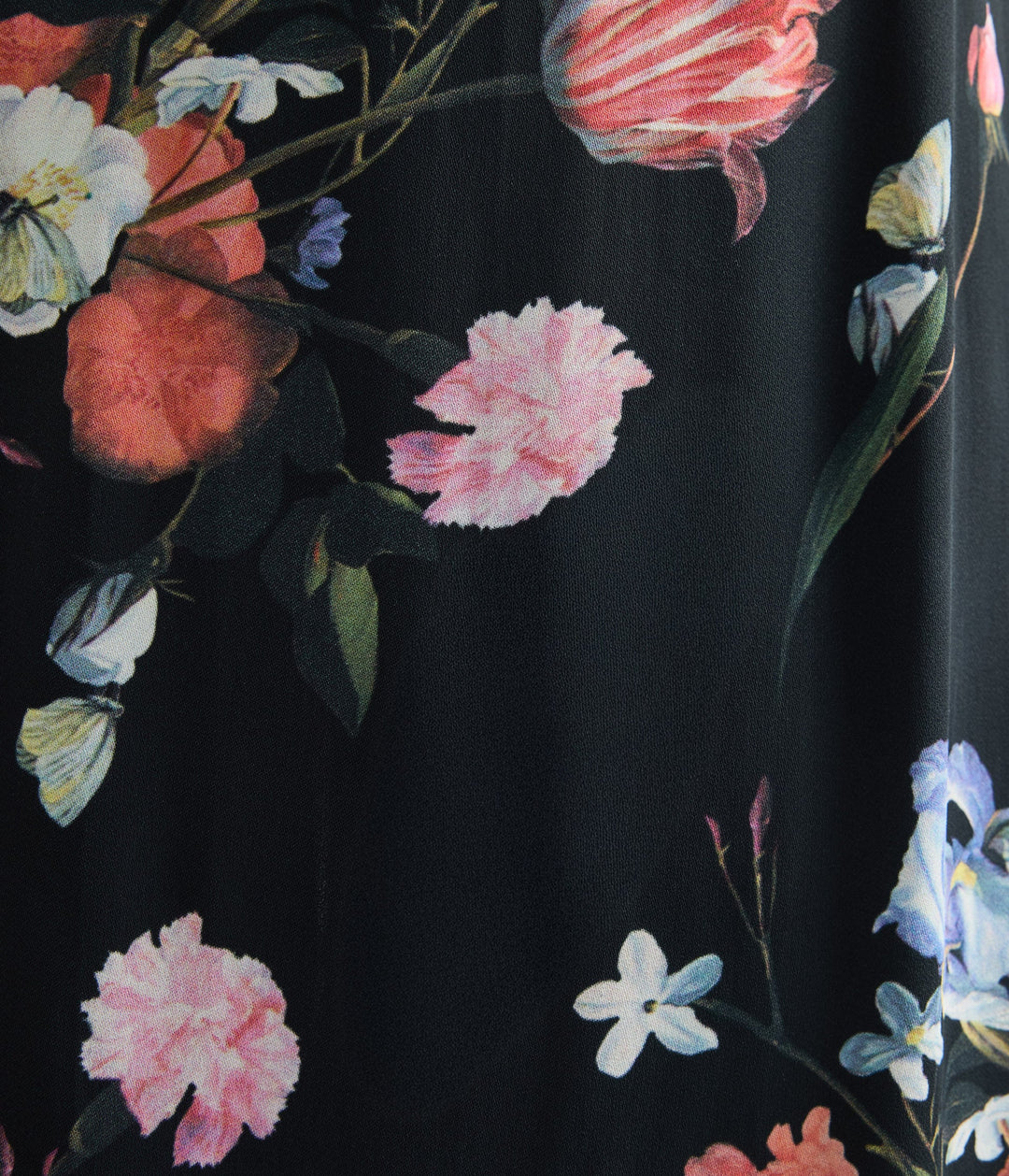 Floral pattern on black fabric with pink, white, and blue flowers.