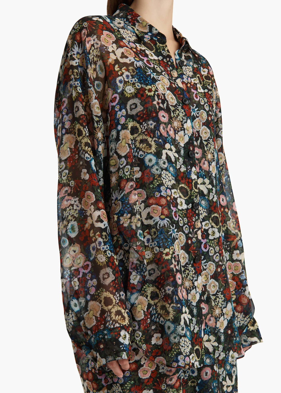 Floral patterned shirt with long sleeves on a white background