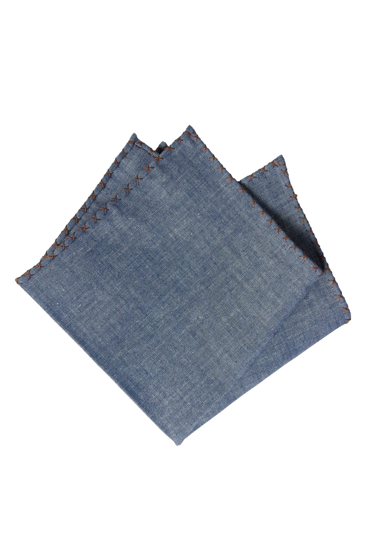 Folded denim fabric on a white background