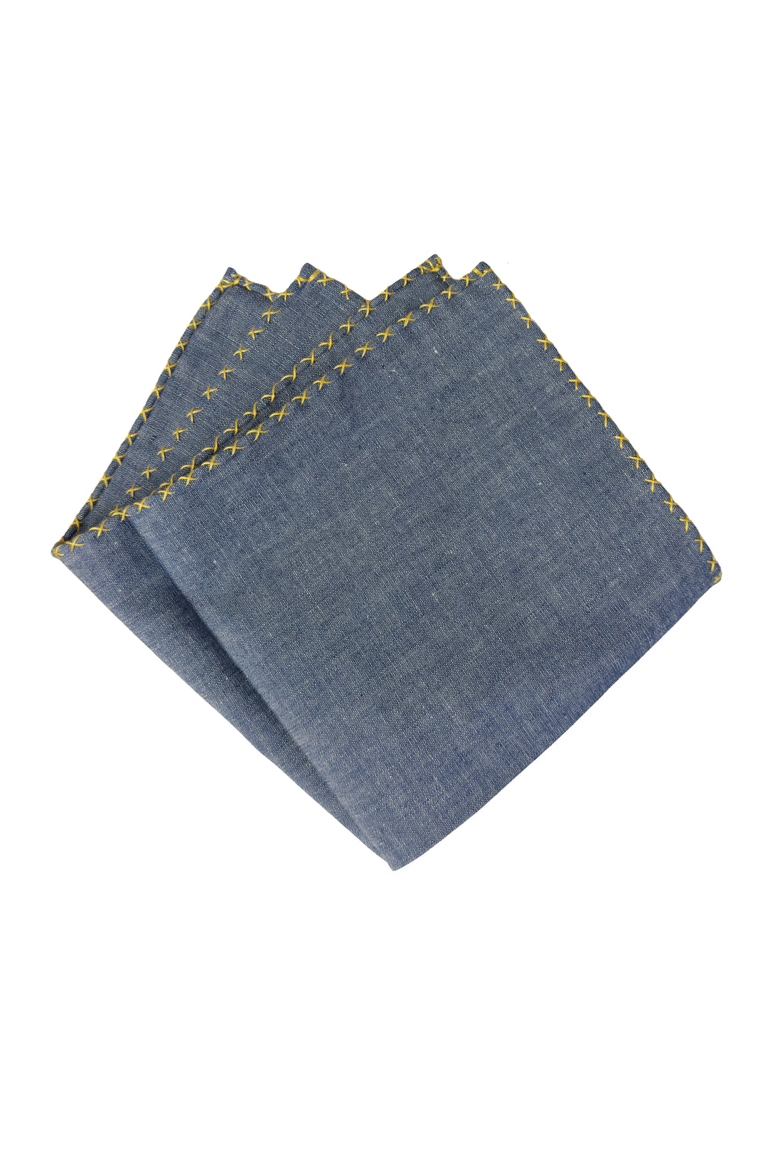 Folded denim fabric with yellow stitching on a white background