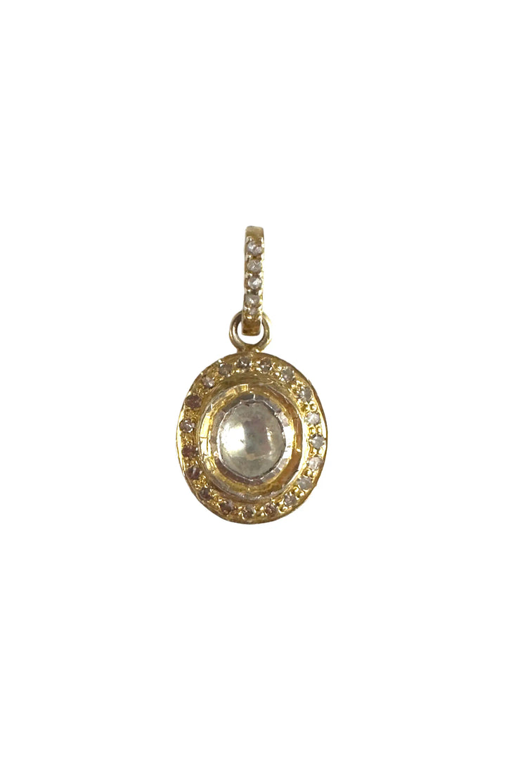 Gold pendant with intricate design on a white background