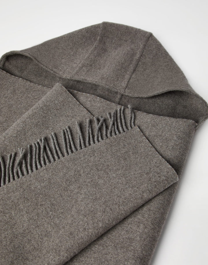 Gray blanket with frayed edge on a white background