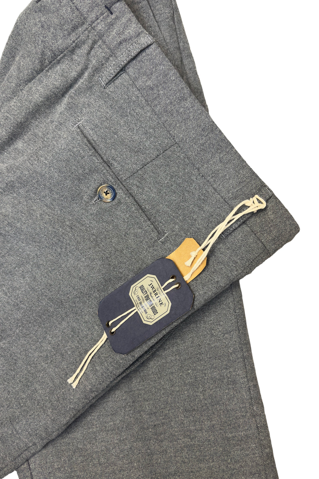 Gray suit jacket with a tag on a white background