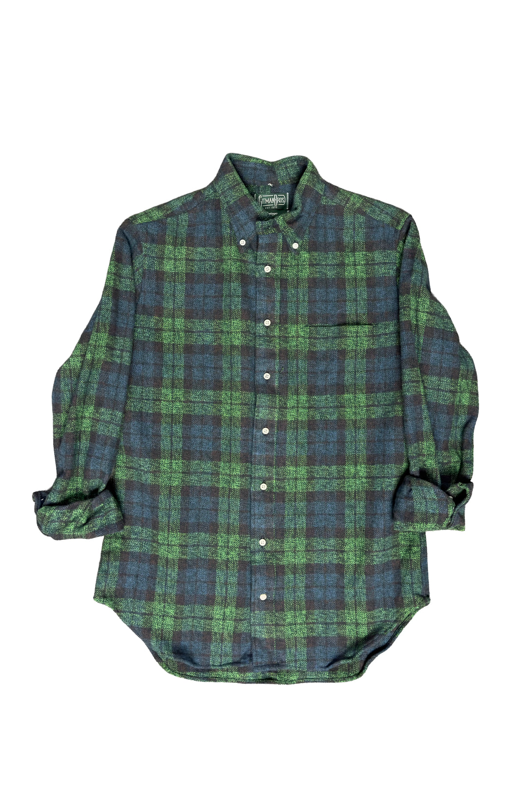 Green and blue plaid shirt on a white background
