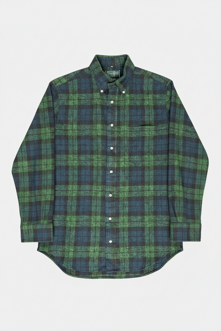 Green and blue plaid shirt on a white background