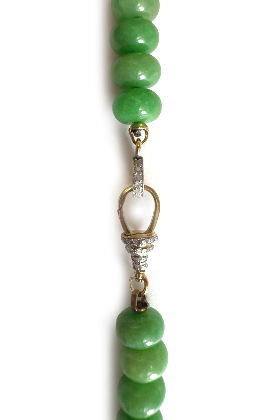 Green beaded necklace with a gold clasp on a white background
