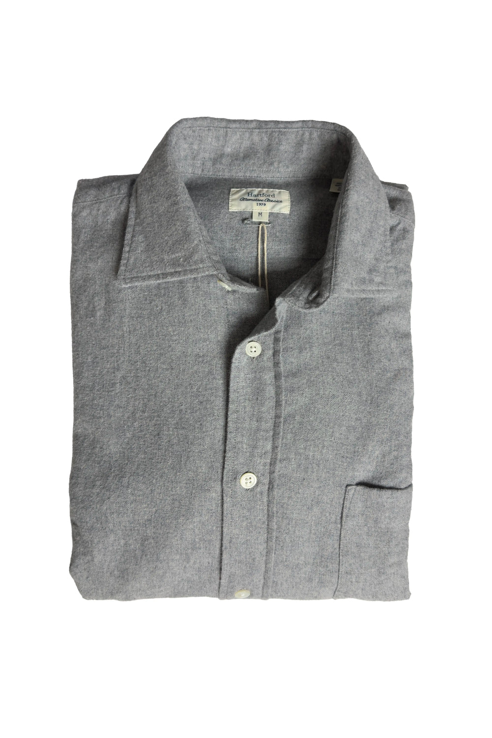 Folded gray shirt with a brand label on a white background