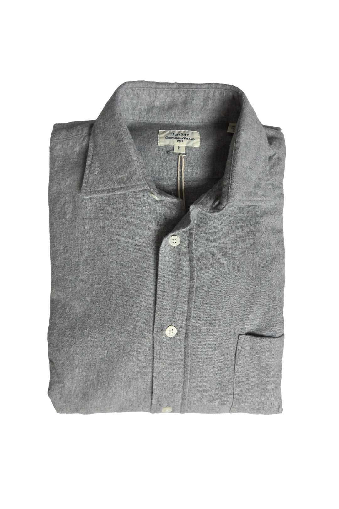 Folded gray shirt with a brand label on a white background