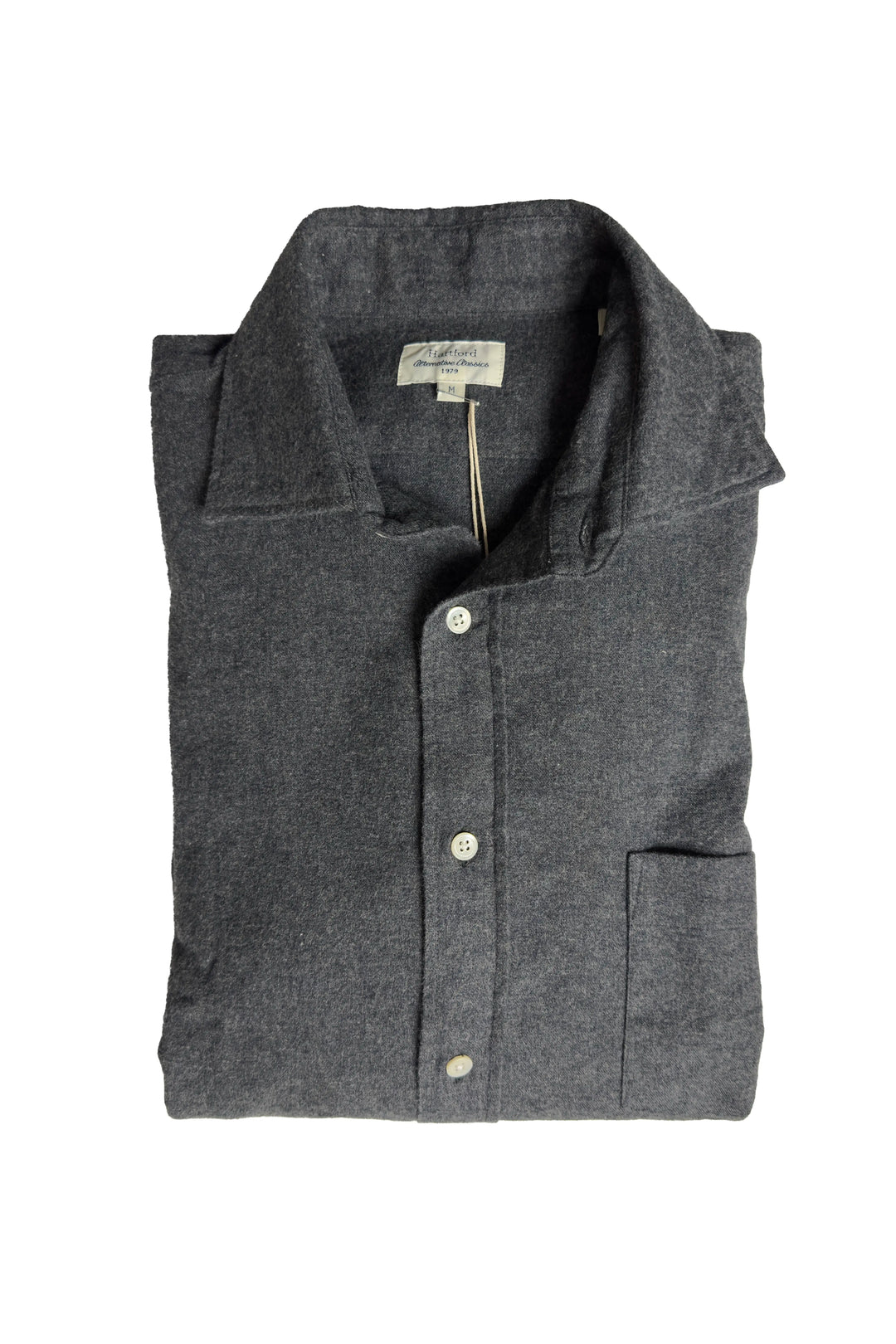 Folded gray shirt with button details on a white background