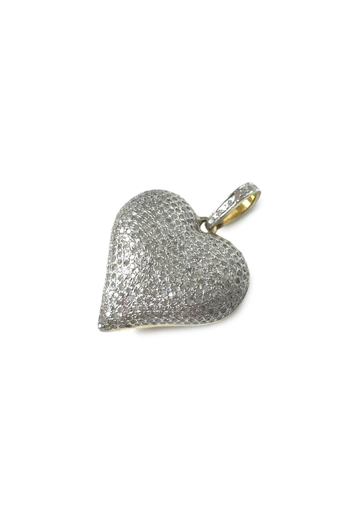Heart-shaped diamond pendant on a white background