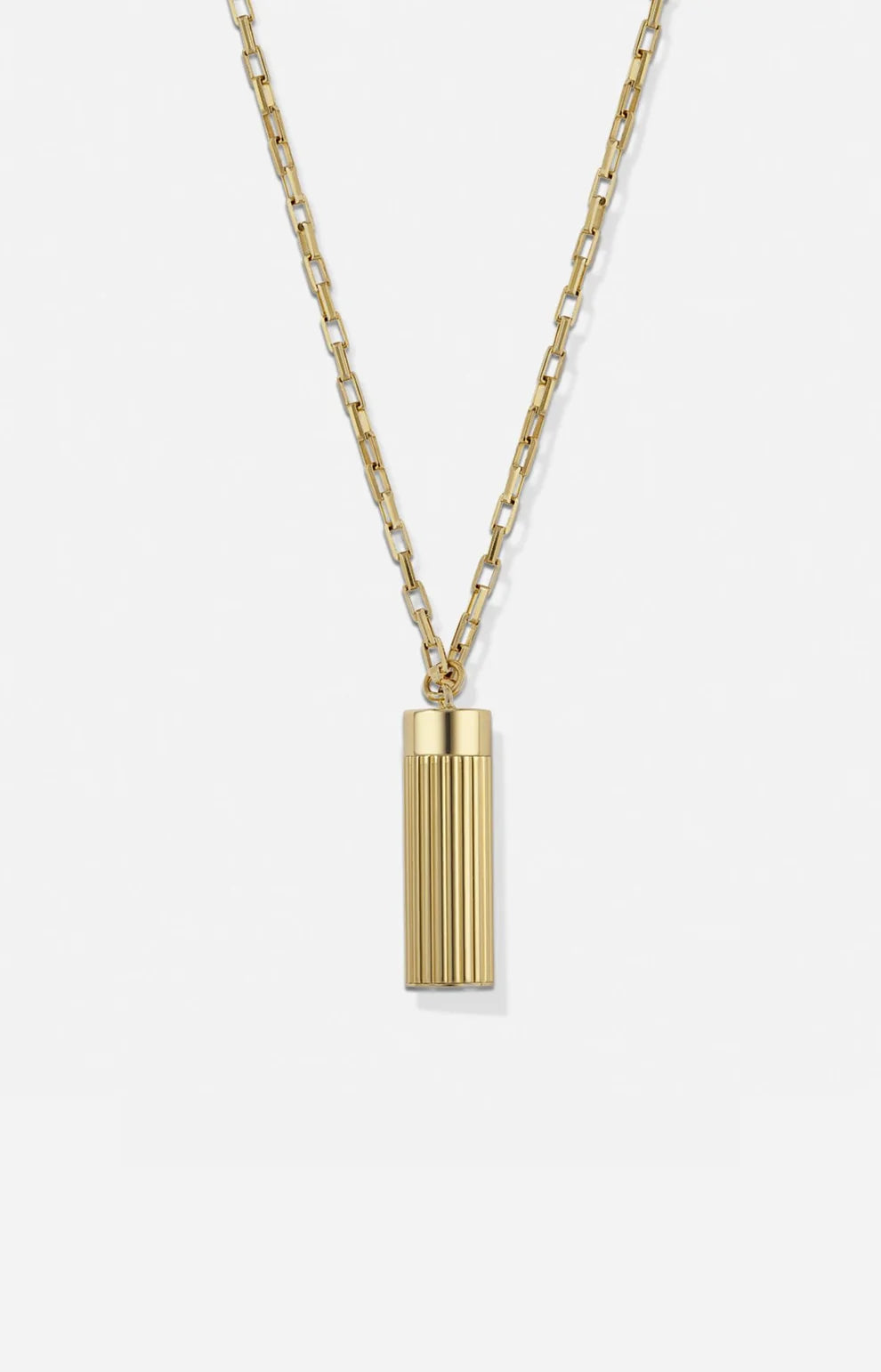 Gold necklace with a cylindrical pendant on a white background