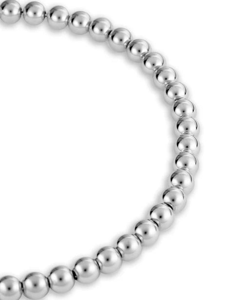 Silver beaded necklace on a white background