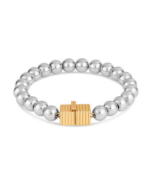 Silver beaded bracelet with a gold clasp on a white background