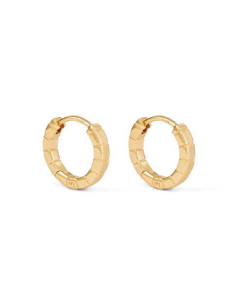 Gold hoop earrings on a white background