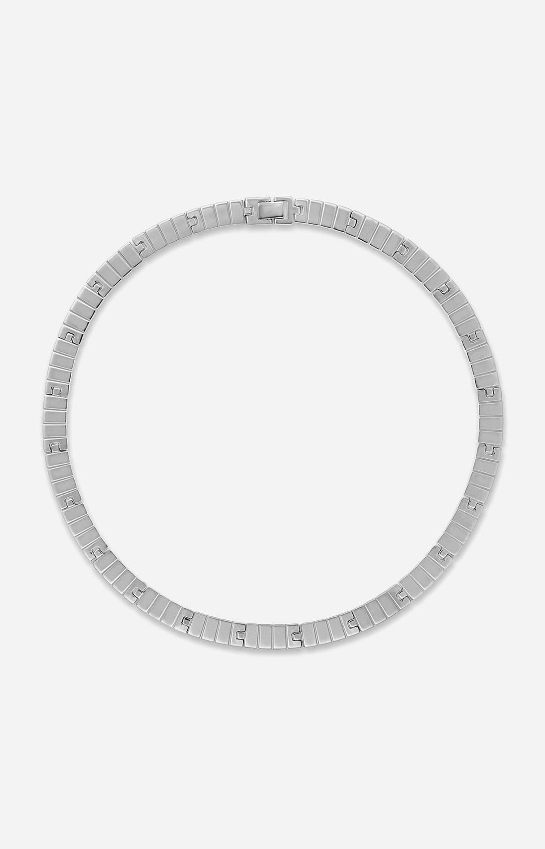 Silver bracelet on a light gray background