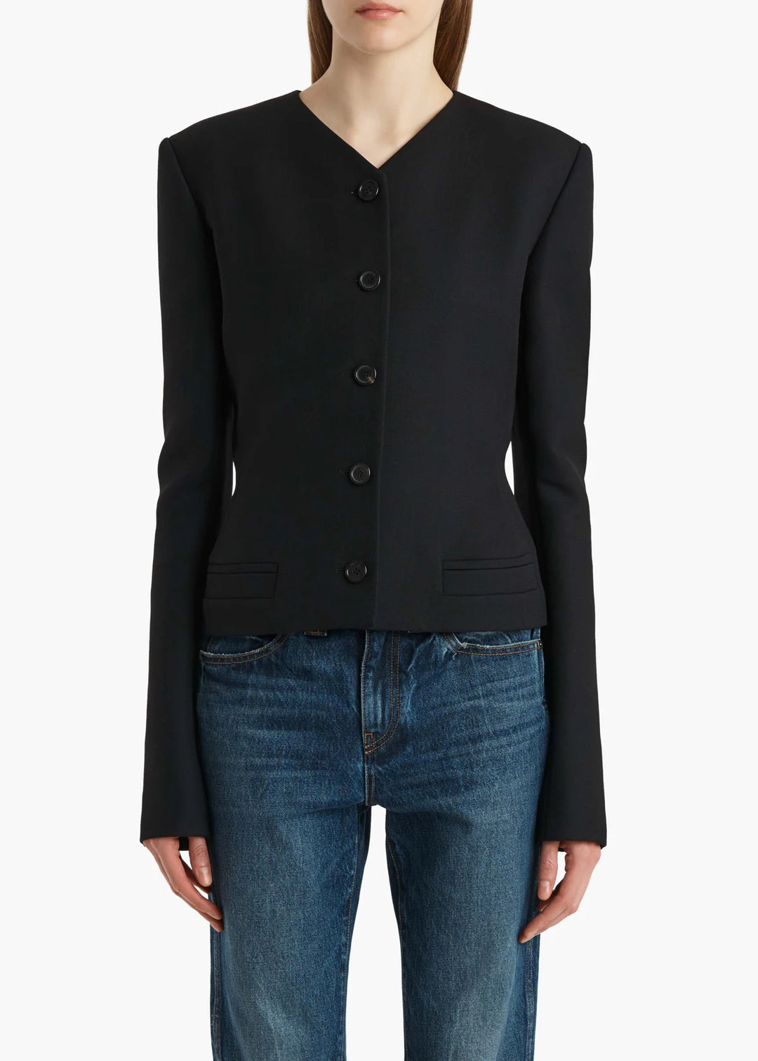 Black button-up cardigan worn by a person on a white background