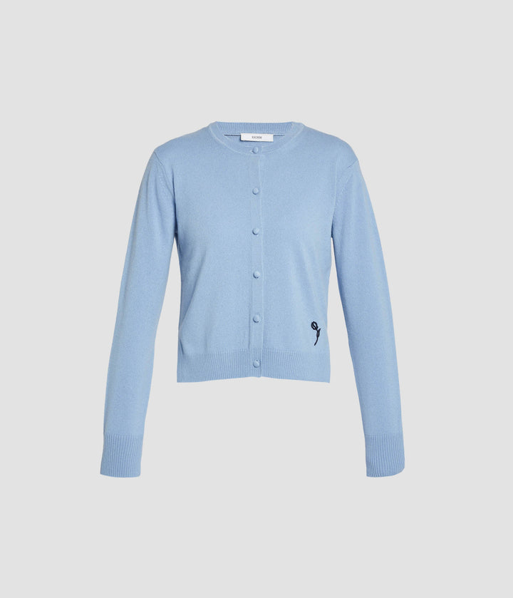 Light blue cardigan on a light gray background