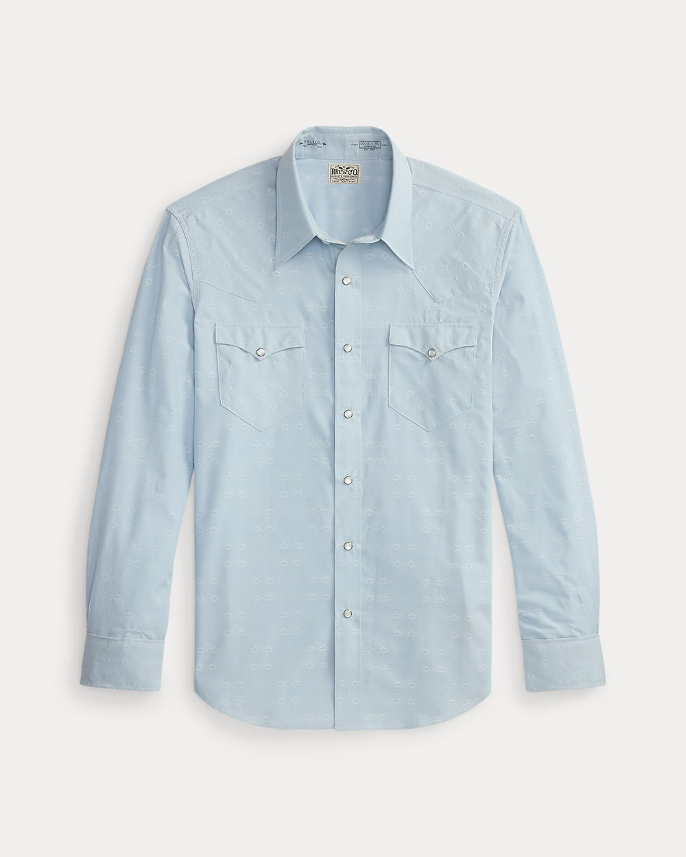 Light blue denim shirt with button details on a light gray background