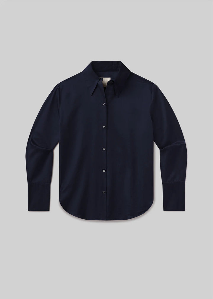 Navy blue shirt on a light gray background