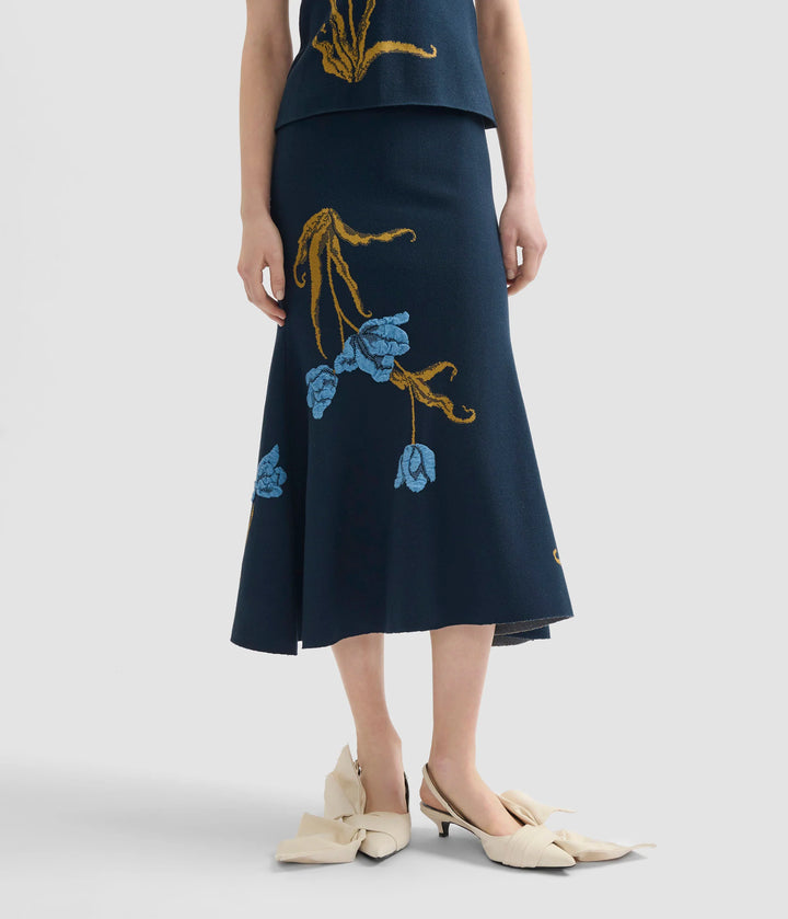 Navy blue skirt with floral embroidery on a white background