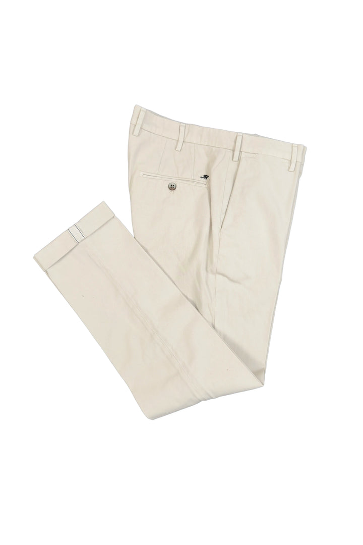Pair of beige pants on a white background