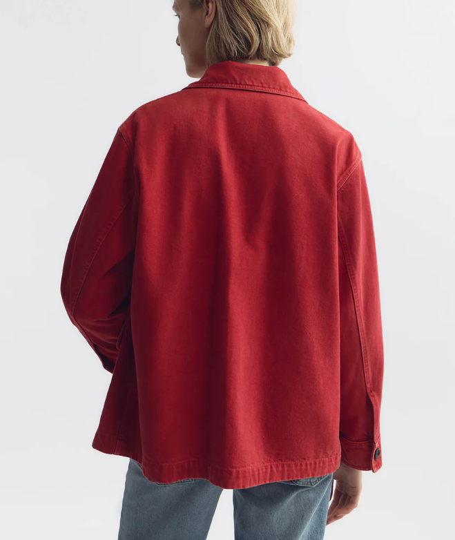 Person wearing a red jacket on a white background