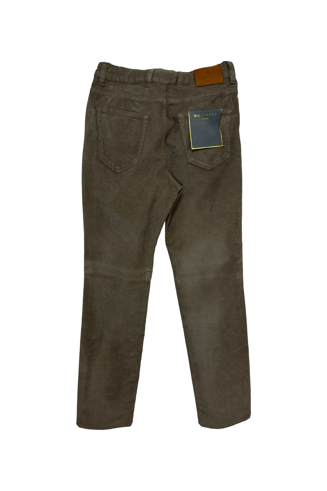 Back view of a pair of dark brown corduroy jeans with a brown leather patch on the back waistband and a blue brand tag on the right pocket, set against a plain white background.