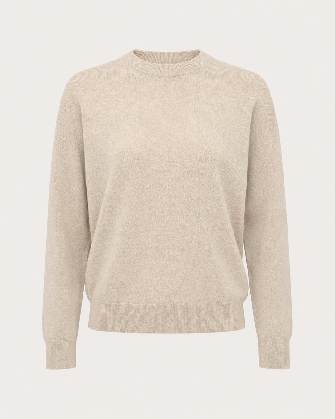 A light beige crewneck sweater with long sleeves, shown on a clean, solid off-white background.