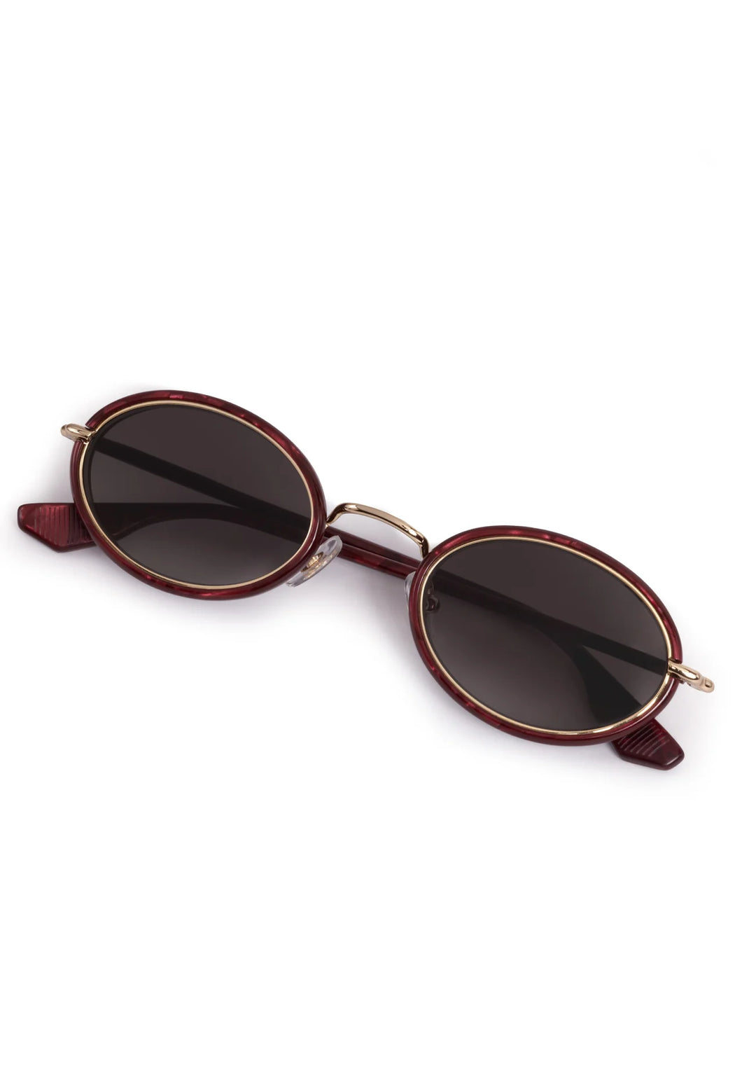 Round sunglasses with dark lenses and gold frames on a white background