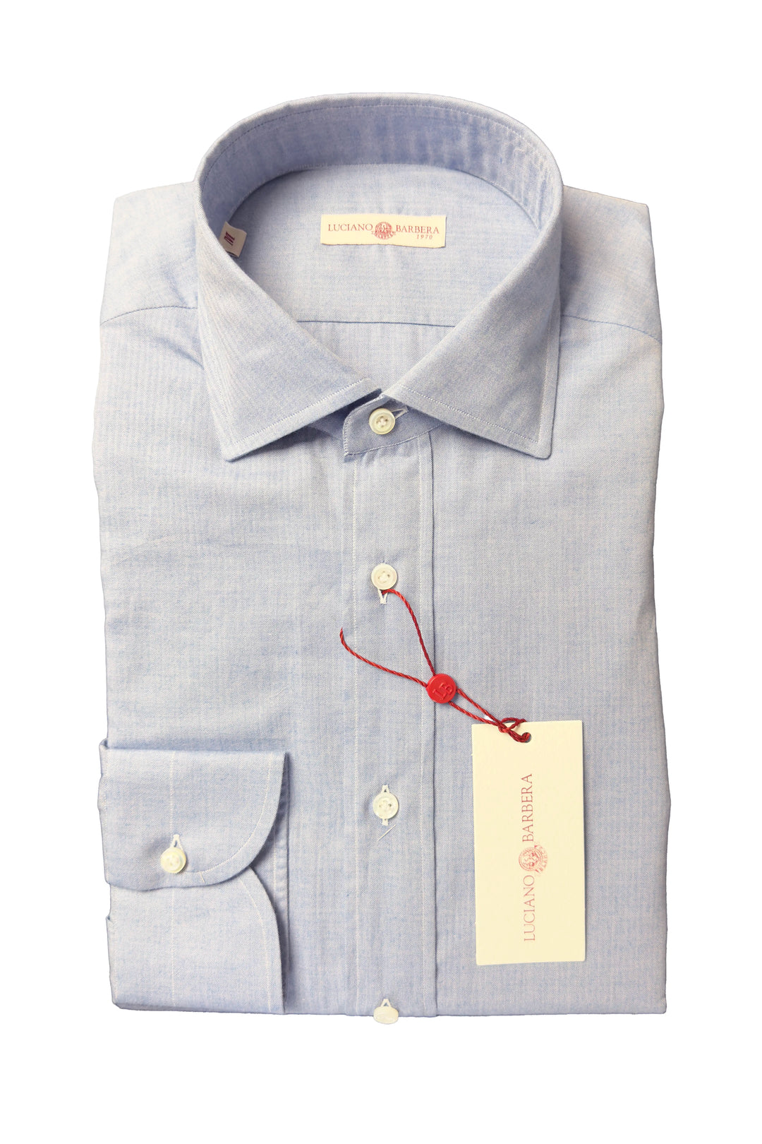 A light blue micro-striped dress shirt by Illiano & Ambra, neatly folded with a button-down front, pointed collar, and a red drawstring holding the brand tag.