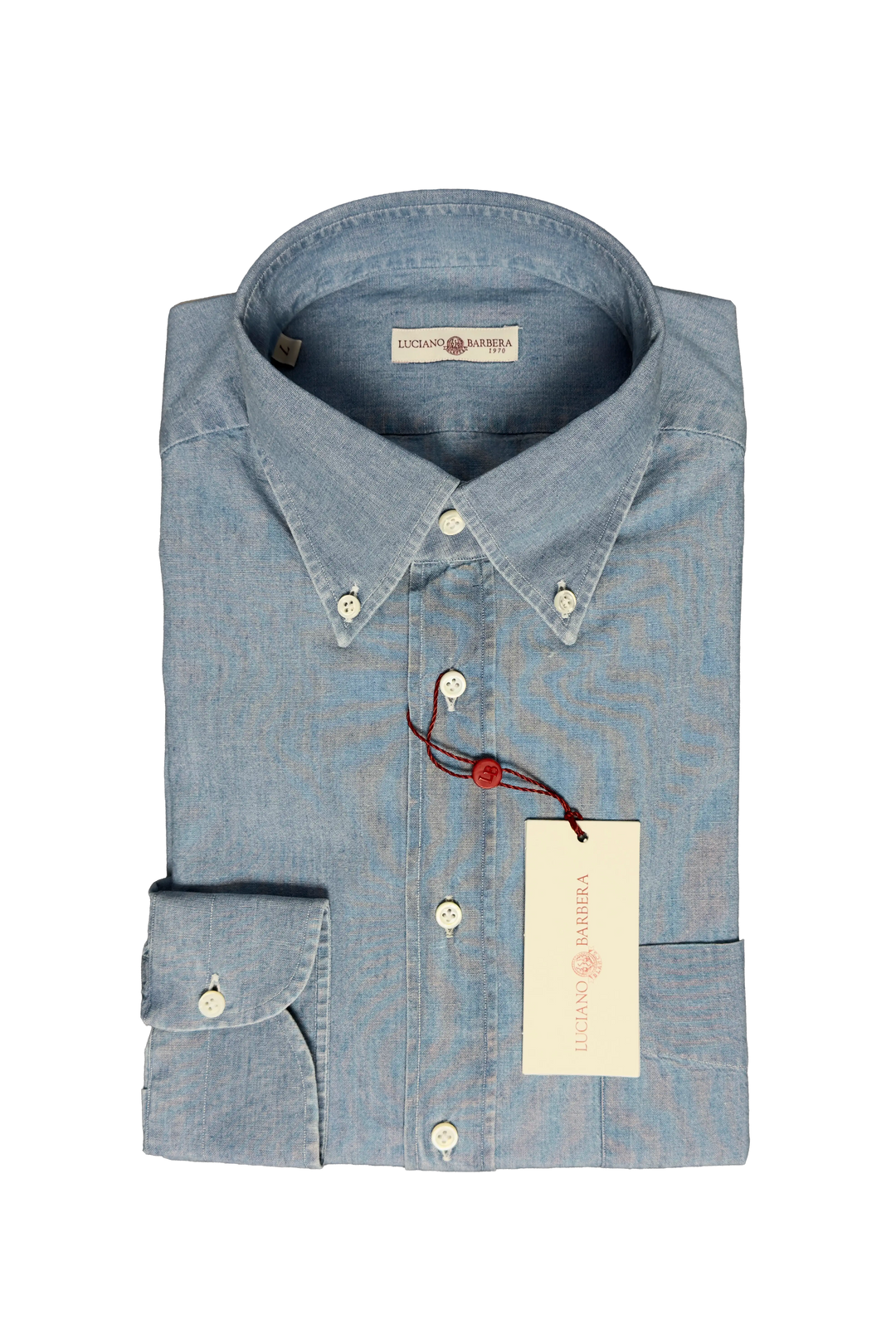 Folded blue shirt with a tag on a white background