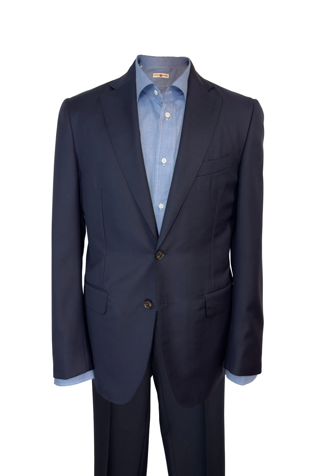 A dark navy blue suit jacket and matching trousers displayed on a headless mannequin torso, styled with a light blue button-down dress shirt. The background is a clean white studio backdrop.