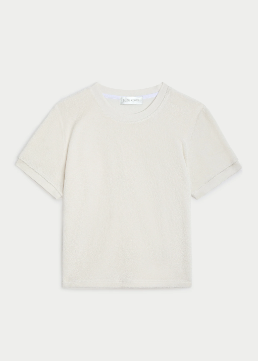White t-shirt on a light beige background