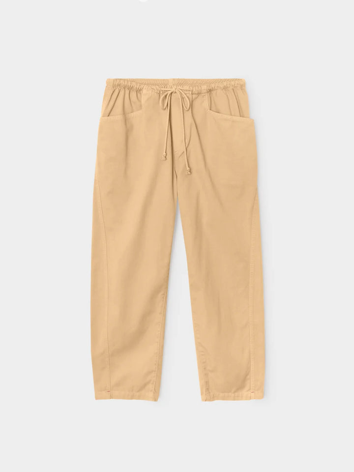 Beige pants with drawstring on a light gray background