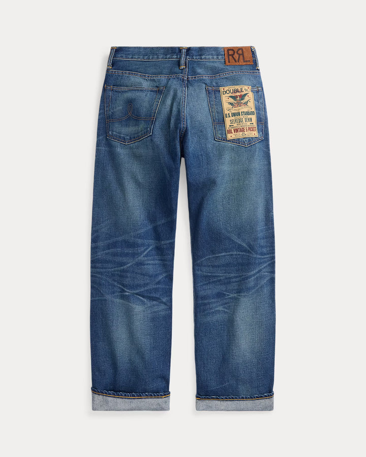 Blue jeans with a brand label on a white background