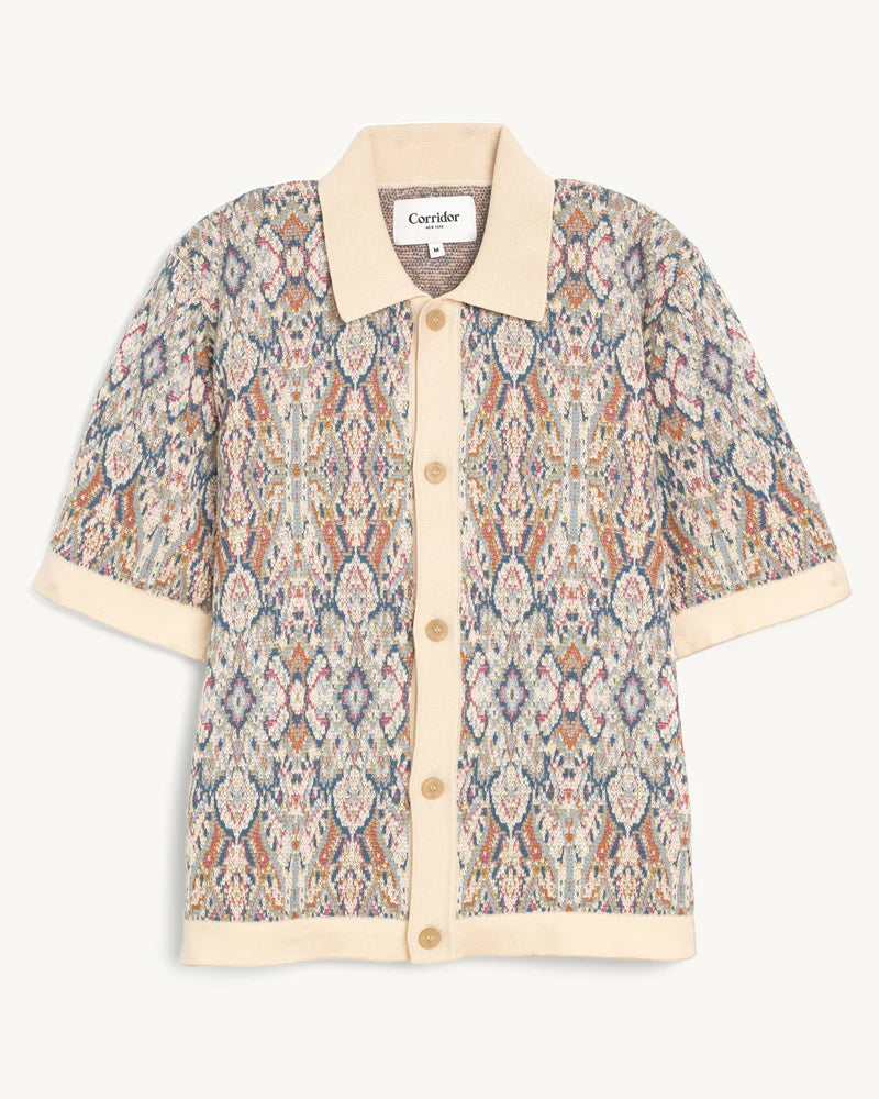 Short-sleeve shirt with a patterned design on a white background