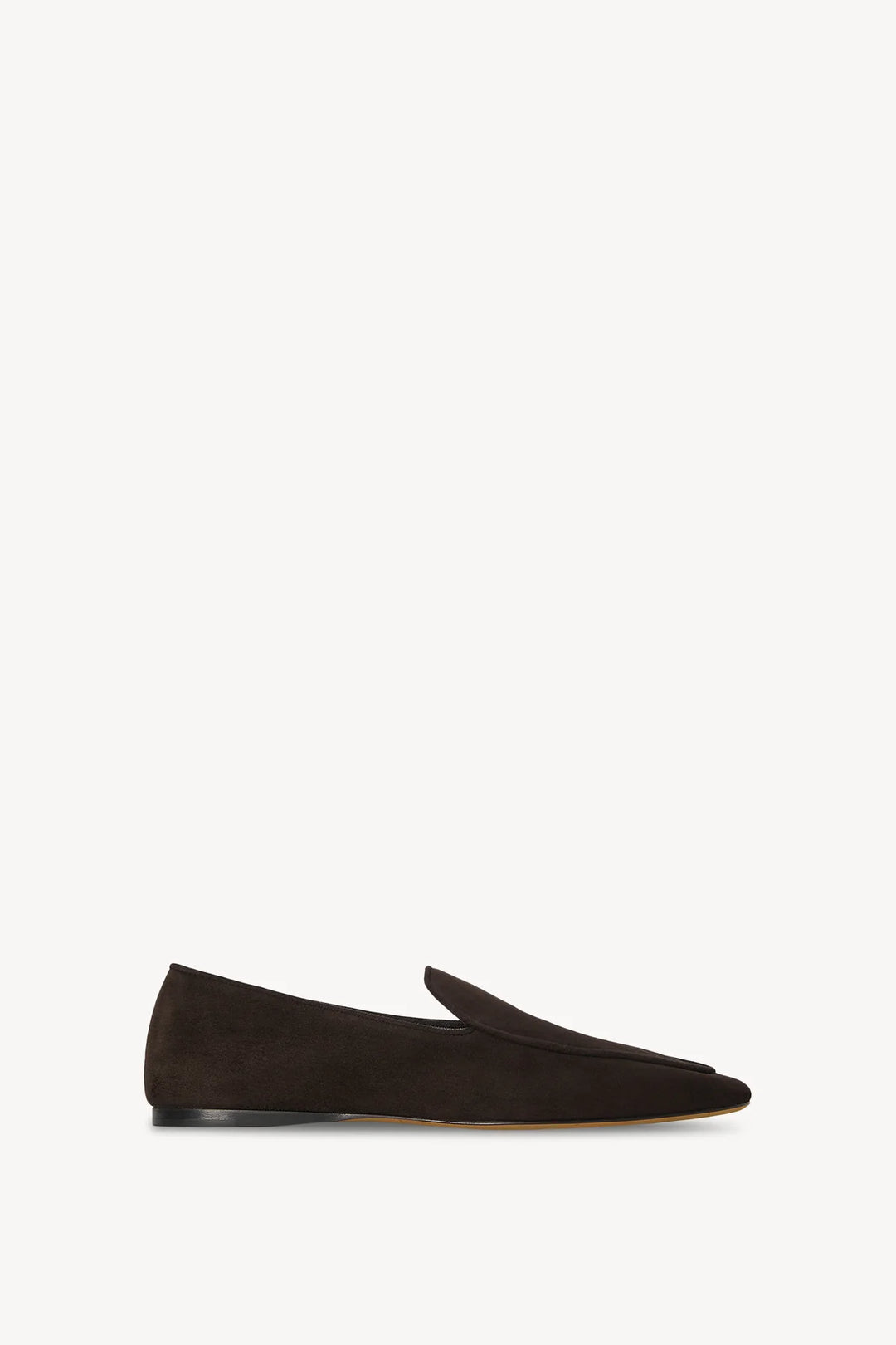 Black suede loafer on a white background