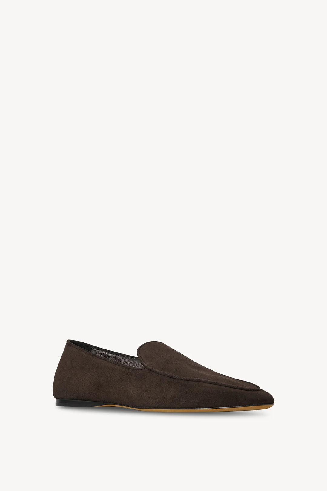 Brown suede loafer on a white background
