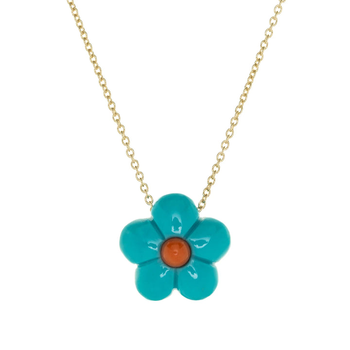 Turquoise flower-shaped pendant on a gold chain against a white background