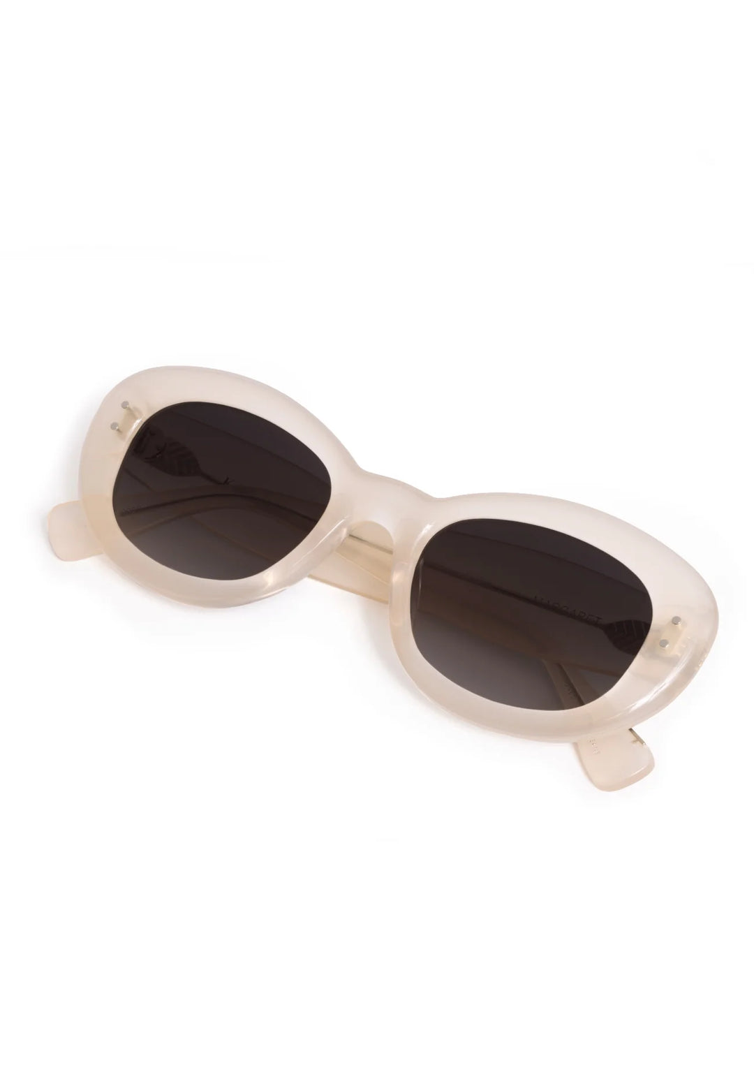 Beige sunglasses with dark lenses on a white background