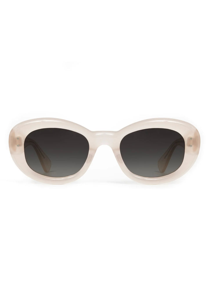 Sunglasses with a beige frame and dark lenses on a white background