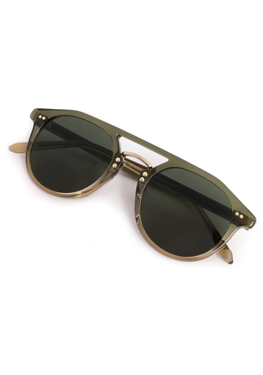 Sunglasses with gold frame and dark lenses on a white background