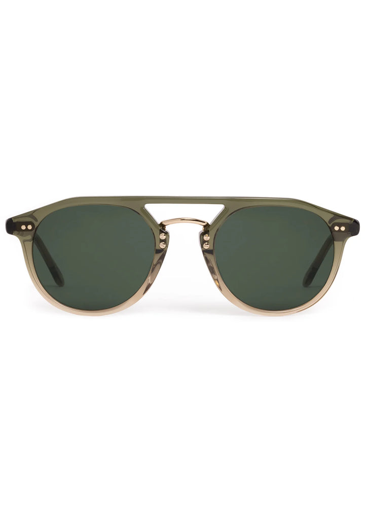 Sunglasses with a gold frame and dark lenses on a white background
