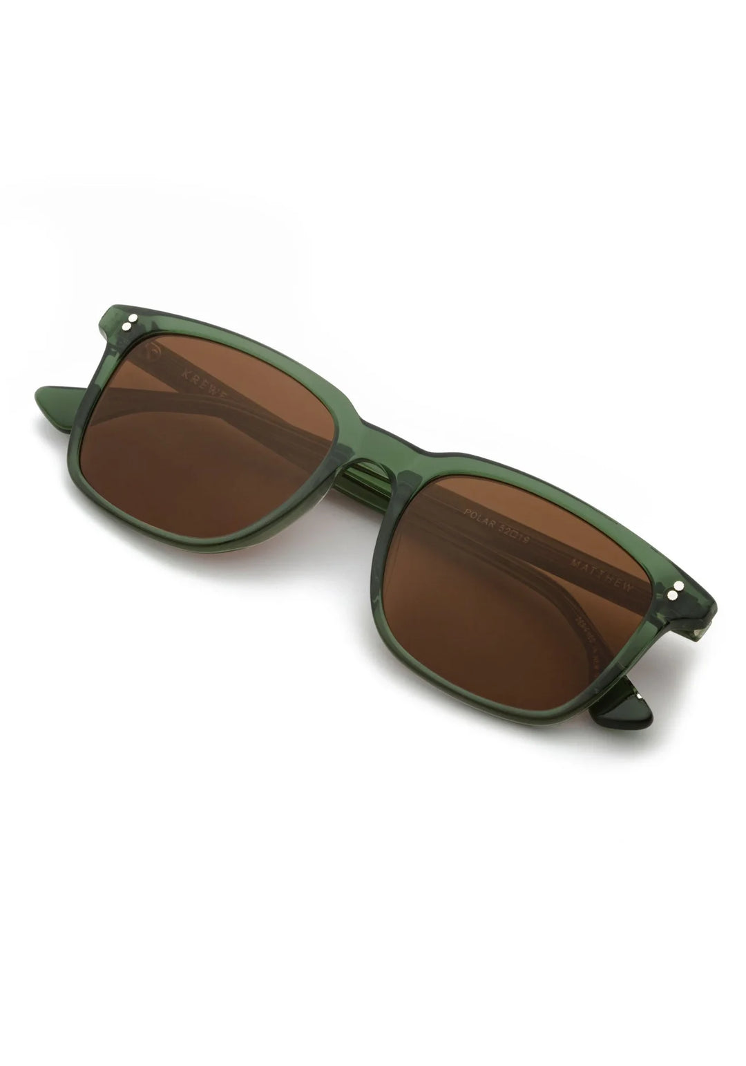Green sunglasses with brown lenses on a white background