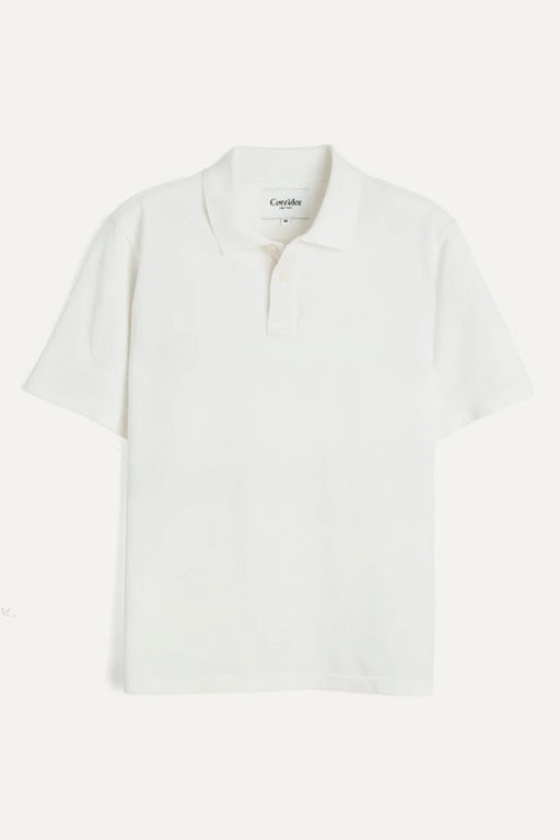 White polo shirt with 'Corridor' branding on a white background
